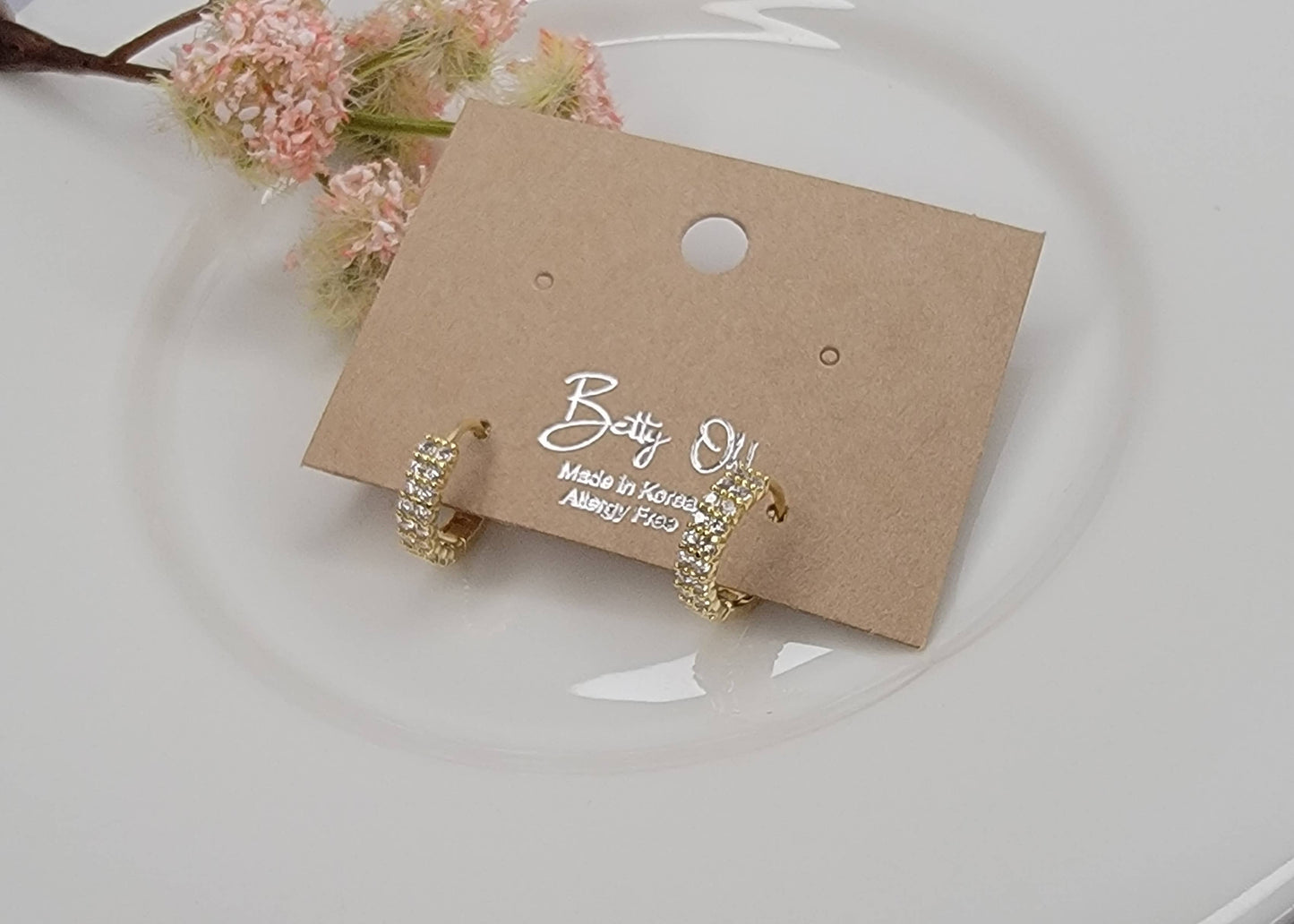 CZ CLICKER EARRINGS.