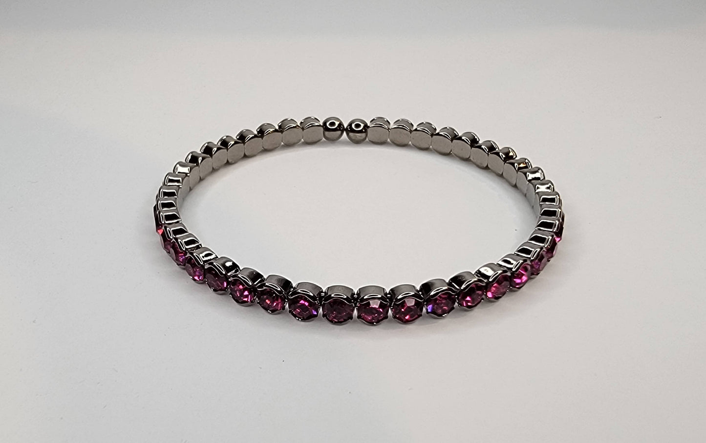 RHINESTONE STACKABLE DARK METAL BRACELET.