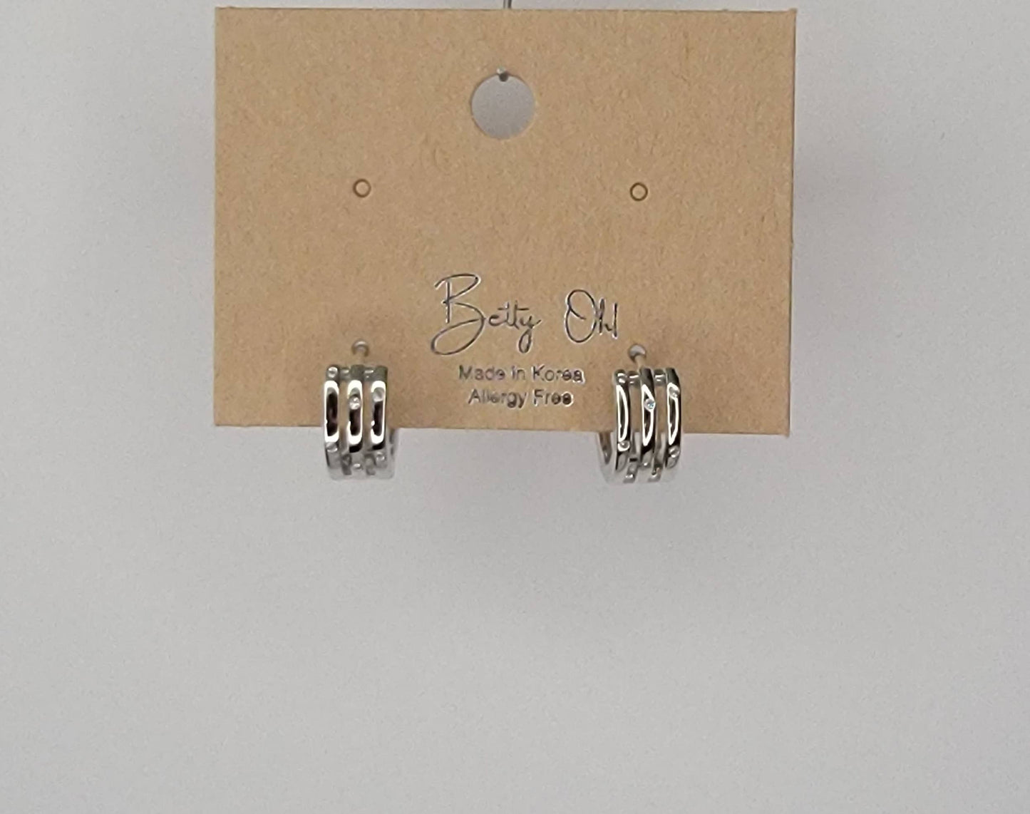 THREE LAYRED WITH RHINESTONE EAR CLICKER EARRINGS.