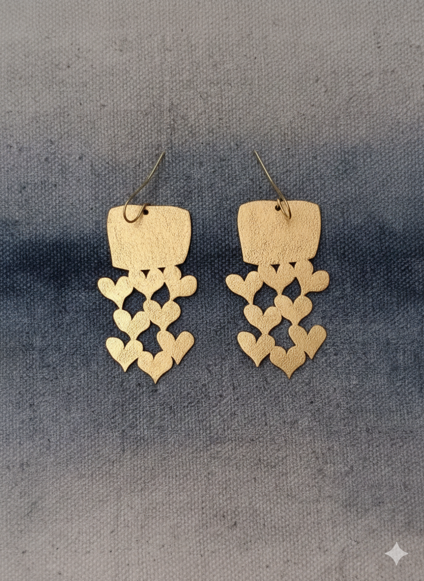 Contemporary handmade brass earrings designed as meaningful