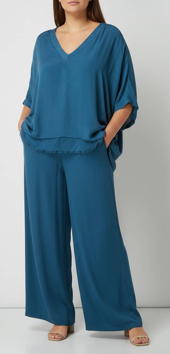 Silk Vneck Ruffle Top
No Tariffs Will Be Added